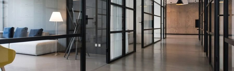 Post-construction cleaning crew detailing a newly built interior